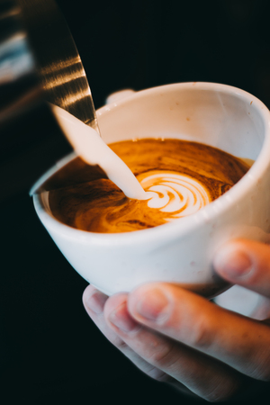 How to make coffee latte art by professional baristaの写真素材
