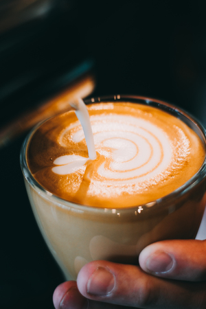 Latte art coffee cup - vintage effect. Professional baristaの写真素材