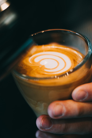 Latte art coffee cup - vintage effect. Professional baristaの写真素材
