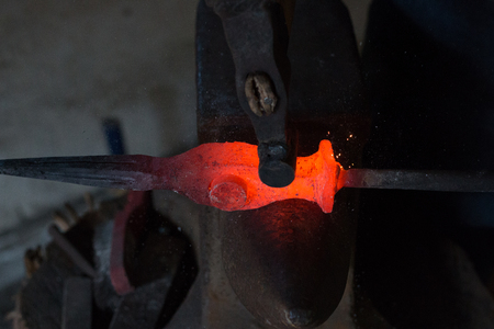 Blacksmiths coals burning for iron work close upの写真素材