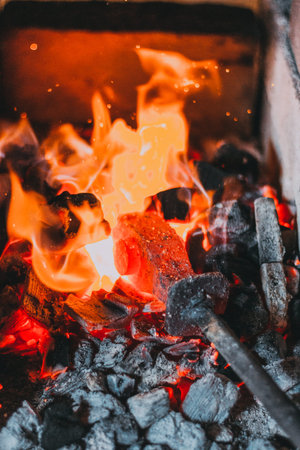 Blacksmiths coals burning for iron work close up