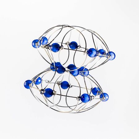 Multicolored handmade three-dimensional model of geometric solid on a white background.の写真素材