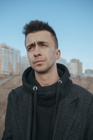 Young white caucasian man intently looking into the distanceの写真素材