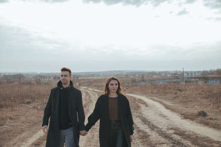 Young loving couple with coffee on ukrainian nature backgroundの写真素材