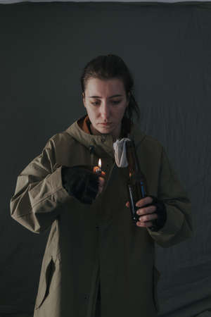 Ukrainian woman with molotov standing for her countryの写真素材