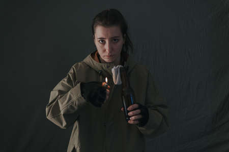 Ukrainian woman with molotov standing for her countryの写真素材