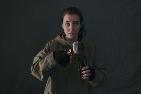 Ukrainian woman with molotov standing for her countryの写真素材