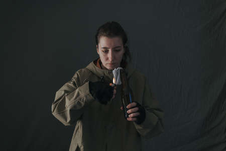 Ukrainian woman with molotov standing for her countryの写真素材