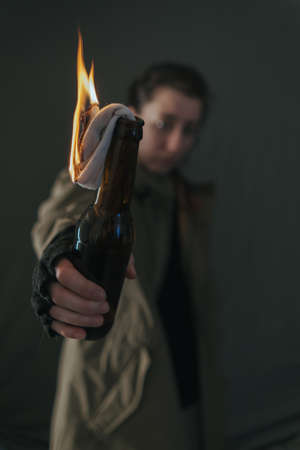 Ukrainian woman with molotov standingの写真素材