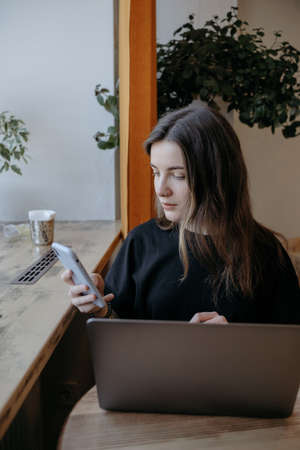 freelance woman happy working in a cafe remotelyの写真素材