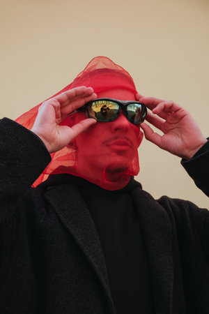 Superhero man with red mask and sunglasses fashion fighterの写真素材