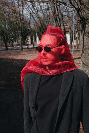 Superhero man with red mask and sunglasses fashion fighterの写真素材