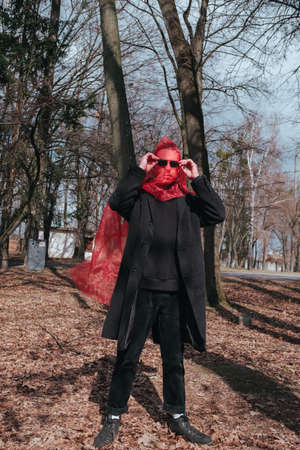 Superhero man with red mask and sunglasses fashion fighterの写真素材