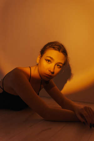 portrait of a young woman with spot lightの写真素材