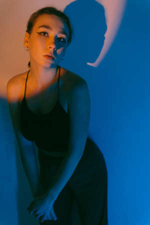 portrait of a young woman with spot lightの写真素材