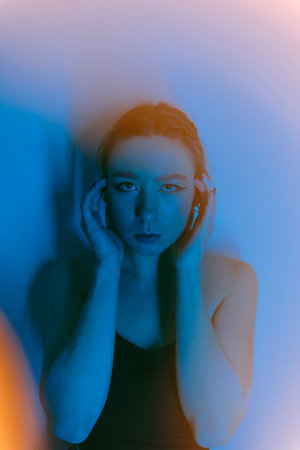 portrait of a young woman with spot lightの写真素材