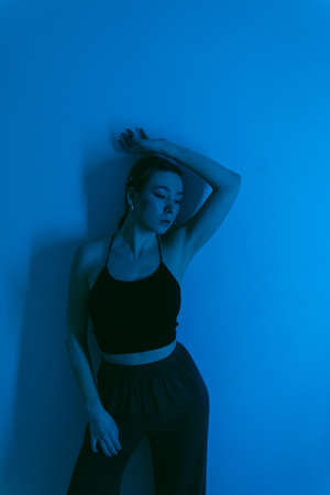 portrait of a young woman with spot lightの写真素材
