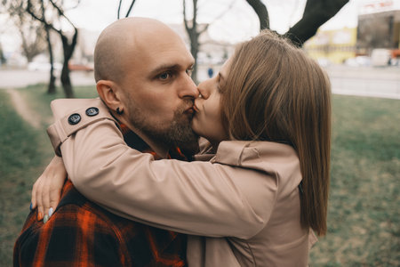 Loving couple embrace with each other. Tree on backgroundの写真素材