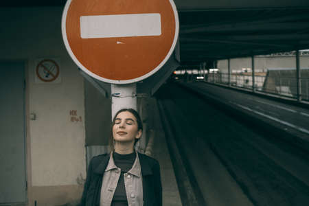 woman portrait near stop signの写真素材