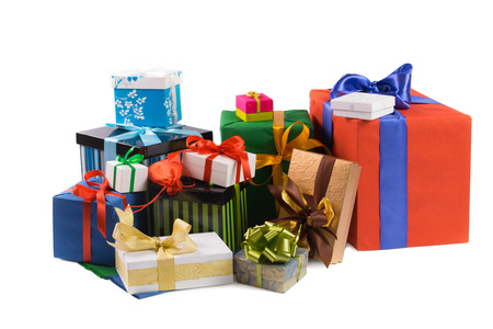 Colorful gift boxes with colored ribbons and wrapping paper on white backgroundの写真素材