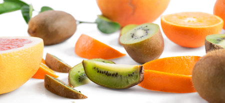 Fresh fruit slices on white backgroundの写真素材