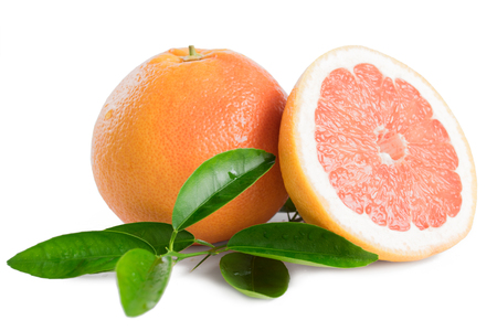 Ripe grapefruit with leaves isolated on white backgroundの写真素材