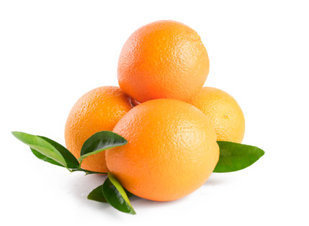 Three ripe oranges with leaves isolated on white backgroundの写真素材