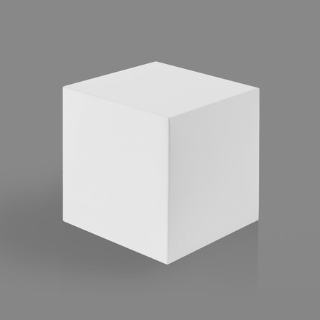 White box (cube) on gray background with reflection and shadow.の写真素材