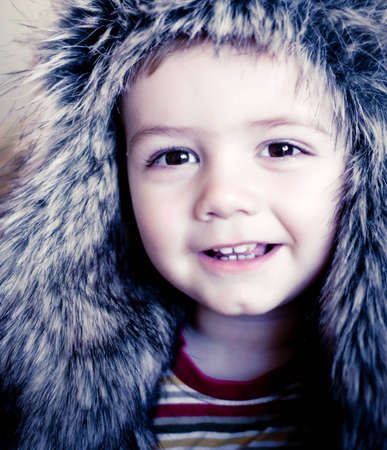 portret of a little smiling  boy  is wearing a   hat の写真素材