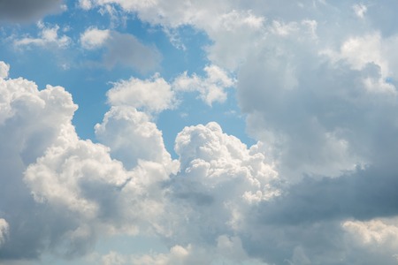 Aerial clouds against a blue sky at noonの写真素材