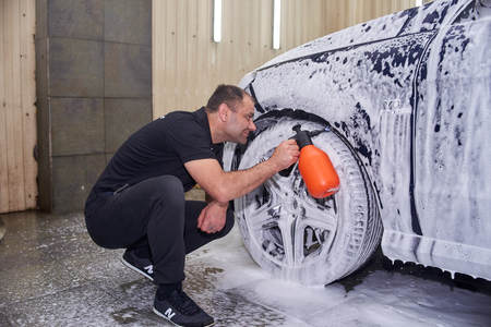Moscow. Russia. 29th of May, 2018. The man washes the car Mercedes mlのeditorial素材