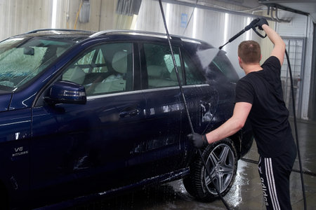 Moscow. Russia. 29th of May, 2018. The man washes the car Mercedes mlのeditorial素材