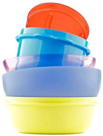 Pyramid of Colorful plastic bowls isolated on white backgroundの写真素材