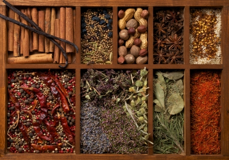 Nine Sections in Wooden Box with Mixed Spices, Herbs and Dried Leafs close upの写真素材
