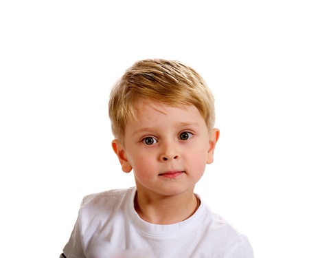 Portrait of Little Blond Boy in White T-Shirt on white backgroundの写真素材