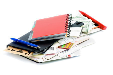 Heap of Travel Concept Objects with Planning, Tickets, Currency, Pen and Other Accessories isolated...