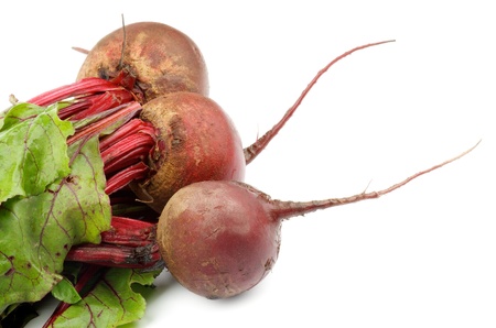 Three Fresh Raw Beetroots with Leafy Tops isolated on white backgroundの写真素材