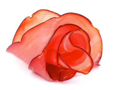 Arrangement of Delicious Prosciutto Slices like Rose isolated on white backgroundの写真素材