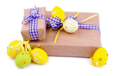 Two Gift Boxes with Checkered Ribbons and Decorated Easter Eggsの写真素材