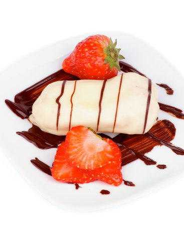 Arrangement of White Chocolate Eclair with Chocolate Sauce and Sliced Strawberry on White Plate...