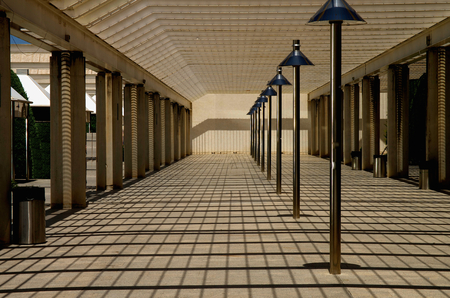 Recreation Terrace with Shadows on Ceiling Blinds and Street Lamps In a Rowの写真素材