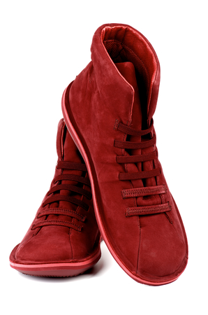 Fashionable Ruby Colored Shammy High Shoes isolated on white backgroundの写真素材