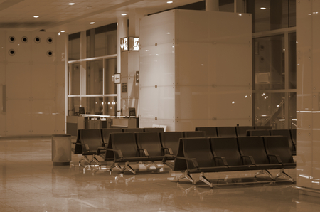 Toned Modern Airport Lounge Zone with Black Chairs. Focus on Foregroundのeditorial素材