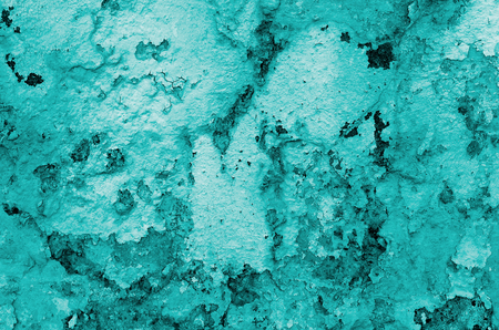 Turquoise Crannied Obsolete Cement Wall Background closeupの写真素材