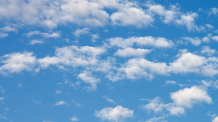 Fluffy White Clouds on Blue Sky in Sunny Day Outdoors