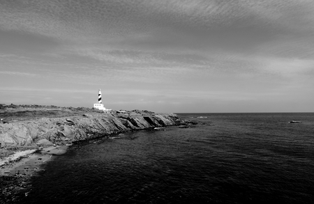 Lighthouse on Mediterranean Shore of Menorca, Balearic Islands. Monochrome Tonedの写真素材