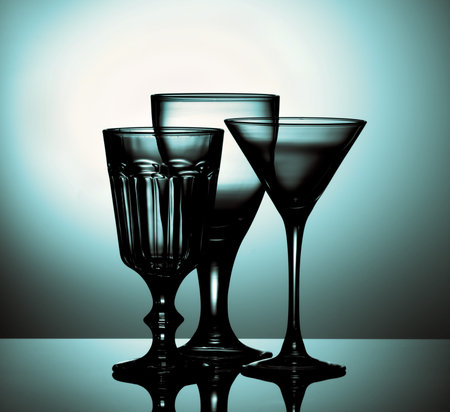 Three Various Empty Wine Glasses for Wine and Martini with Reflection on Glass and Shadow Backlight. Turquoise Tonedの写真素材