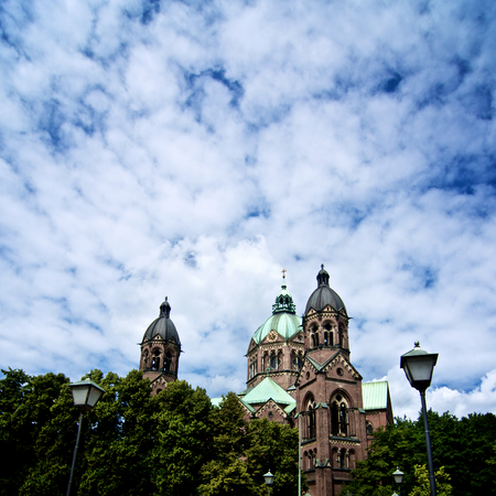 Domes of St. Lukas Church - Lukaskirche against Cloudy Sky Outdoors. Munich, Bavaria, Germanyの写真素材