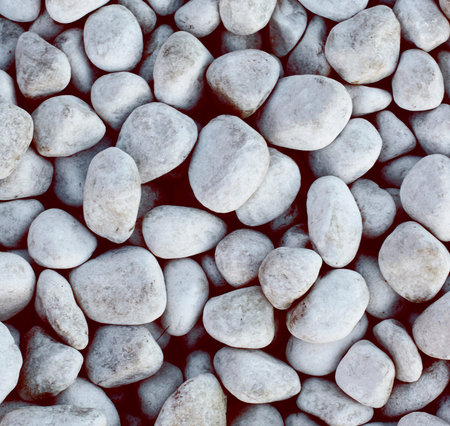 Background of Seashore Grey Rounded Pebbles closeup Outdoors