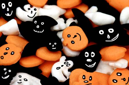 Orange, Black and White Candy with Eyes closeup. Selective Focusの写真素材